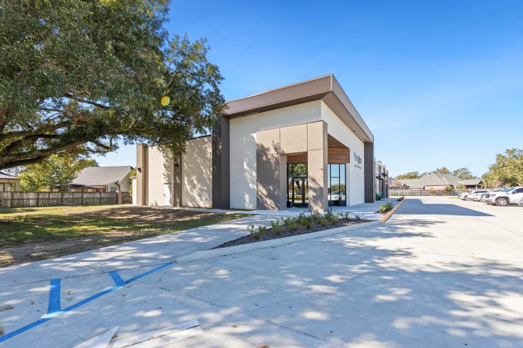 Side exterior of a commercial unit at Oak Center Development in Lafayette with mature oak tree and contemporary facade by A Beazley Architecture